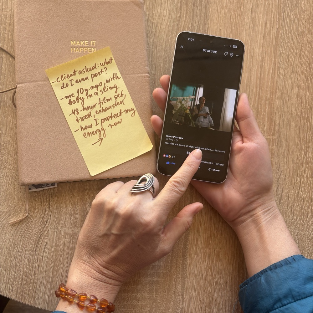 A handwritten sticky note next to the finished post on a phone